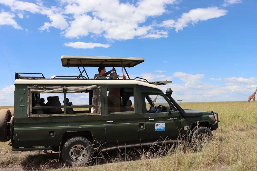 Couples enjoying a game drive in a 4x4 on a Honeymoon Safari Masai Mara.
