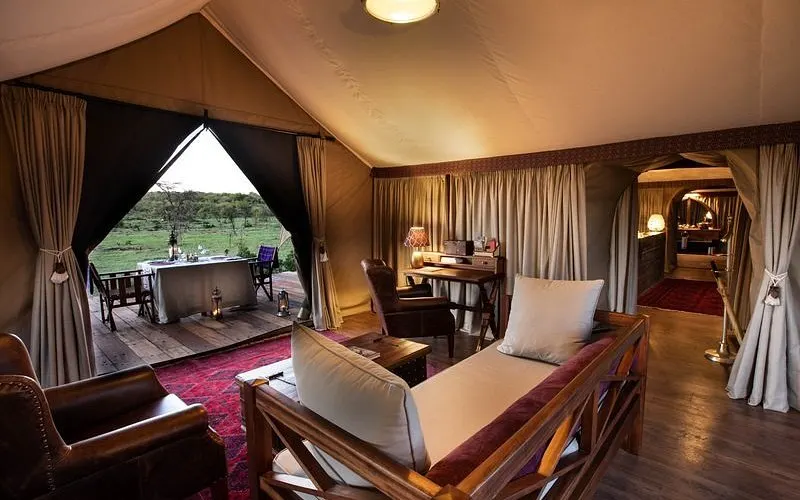 Inside a luxury safari tent at Mara Plains Camp overlooking the Masai Mara savanna.