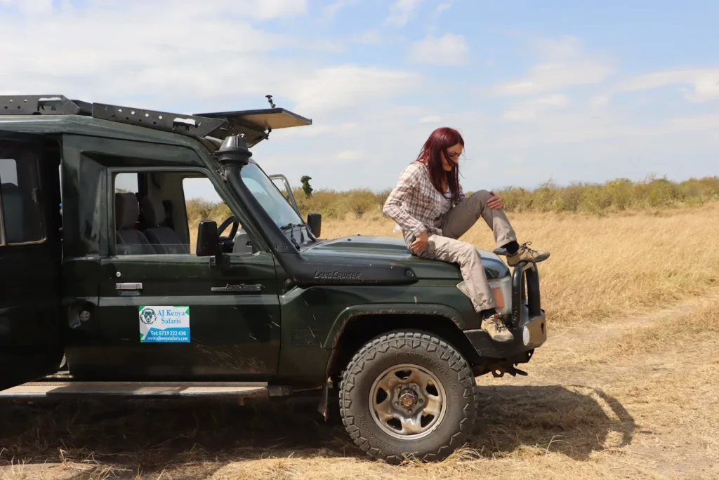 A traveler scouting near the best place to see migration in Masai Mara.