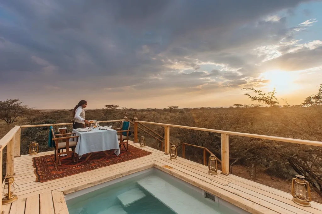 Private plunge pool and sunset dining deck at luxury Mara Plains Camp.