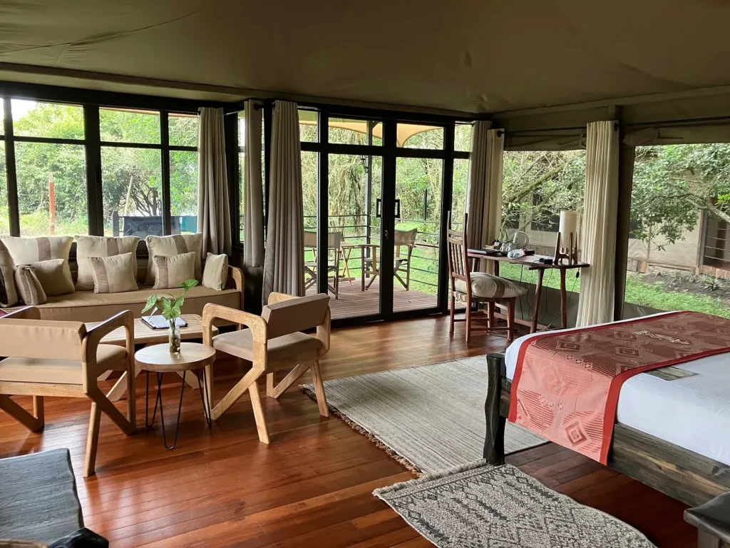 Luxury suite tent interior with large glass doors at Ashnil Mara Camp.
